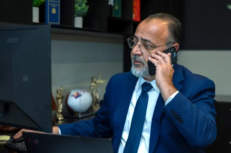 WCTL Co-CEO Allen talking on the phone with a client.